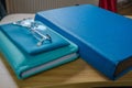 Blue Monday. A book, a notebook and a case with glasses, all in blue tones Royalty Free Stock Photo