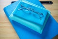 Blue Monday. A book, a notebook and a case with glasses, all in blue tones Royalty Free Stock Photo