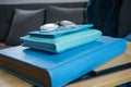 Blue Monday. A book, a notebook and a case with glasses, all in blue tones Royalty Free Stock Photo