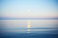 blue moon shining over calm ocean waters Royalty Free Stock Photo