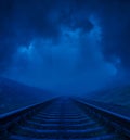 Blue moonlight in night over railway