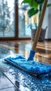 Blue Mop and Cloth Cleaning a Wooden Floor Royalty Free Stock Photo