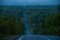 A blue morning on a country road with a big steep hill Royalty Free Stock Photo