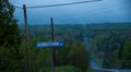 A blue morning on a country road with a big steep hill Royalty Free Stock Photo