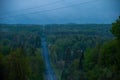 A blue morning on a country road with a big steep hill Royalty Free Stock Photo