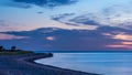 Peaceful sea with a motorboat on the beach