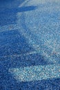 Blue mosaic old dirty tiles of an empty swimming pool. Royalty Free Stock Photo