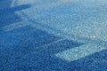 Blue mosaic old dirty tiles of an empty swimming pool. Royalty Free Stock Photo