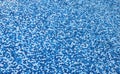 Blue mosaic old dirty tiles of an empty swimming pool. Royalty Free Stock Photo