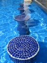 Blue mosaic pool seats Royalty Free Stock Photo