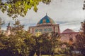 Blue mosque behind yard garden. Elegant islamic masjid building. Travel to Armenia, Caucasus. Touristic architecture landmark. Sig Royalty Free Stock Photo