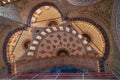 The blue mosque interior dome ceiling beautiful ornamental decoration and lighting with historical restoration framework Royalty Free Stock Photo