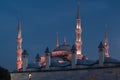 Blue Mosque at night with golden illumination, wide view of Istanbul in dusk. Sultanahmet Camii mosque with six minarets Royalty Free Stock Photo