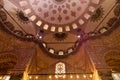 Blue Mosque Sultan Ahmet Cami ornate interior dome ceiling decoration in Istanbul, Turkey Royalty Free Stock Photo