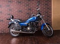 Blue motorbike parked indoors Royalty Free Stock Photo