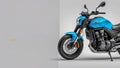 Blue motorcycle against a plain background view Royalty Free Stock Photo