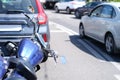 Blue motorcycle lying in front of car on road closeup Royalty Free Stock Photo