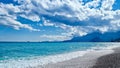 blue mountains and sky and blue water with white foam waves mediterranean sea beach Royalty Free Stock Photo