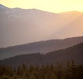 Amazing mountain landscape with colorful vivid sunset on the cloudy sky, natural outdoor travel background Royalty Free Stock Photo