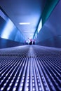 Blue moving escalator in the office hall Royalty Free Stock Photo