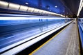 Blue moving escalator with people