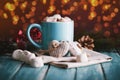 Blue mug filled with hot chocolate with marshmallow candies Royalty Free Stock Photo