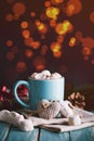 Blue mug filled with hot chocolate with marshmallow candies Royalty Free Stock Photo