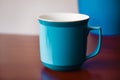 A blue mug. Tranquil Serenity. A Captivating Blue Mug. Generative AI