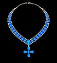 blue necklace with a cross from jewels