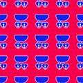 Blue Necklace with heart shaped pendant icon isolated seamless pattern on red background. Jewellery decoration Royalty Free Stock Photo