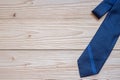 Blue necktie on wooden background with copy space for text. Happy Father`s Day and International Men`s Day concepts