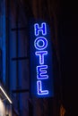 Blue neon hotel sign in the night Royalty Free Stock Photo