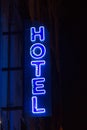 Blue neon hotel sign in the night Royalty Free Stock Photo