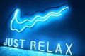 Blue neon sign just relax. Trendy style