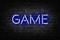 Blue neon sign of the word GAME on dark brick wall