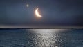 Blue night starry sky and full moon fluffy clouds ,reflection on sea water pink sunset on horizon black silhouette tree  , people Royalty Free Stock Photo