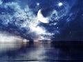 Blue night  starry sky and moon on sunset fluffy dramatic clouds at  water wave reflection at sea nature landscape background Royalty Free Stock Photo