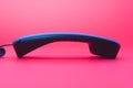 Blue nonmobile telephone handset isolated on pink Royalty Free Stock Photo