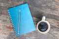 Blue note book with coffee cup