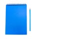 Blue notepad and blue pencil isolated on white background. Copy space Royalty Free Stock Photo