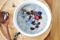 Blue oatmeal bowl on wooden tray