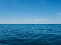 a blue ocean with a clear sky in the background Royalty Free Stock Photo