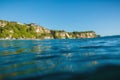 Blue ocean and cliff in Uluwatu, Bali and sunset light Royalty Free Stock Photo