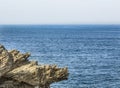 Blue ocean with rocky outcrop