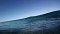 Blue Ocean Surfing Wave Breaks Over the Camera in Hawaii