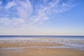 Blue ocean view of calm sea water on a summer morning. Nature landscape of a coastline with a blue sky and white clouds Royalty Free Stock Photo
