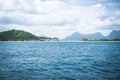 Blue ocean and village at sand beach with palm trees at El Nido bay, Palawan, Philippines Royalty Free Stock Photo