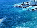 Blue ocean water, with rock reef in background, Tenerife
