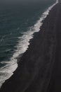 Aerial view of Iceland ocean wave cresting on black sand beach Royalty Free Stock Photo