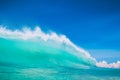 Blue ocean wave at tropical beach. Clear wave in tropics and blue sky